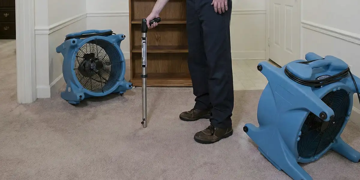 emergency water removal equipment deployed to dry a flooded residential interior in Bloomington, IN