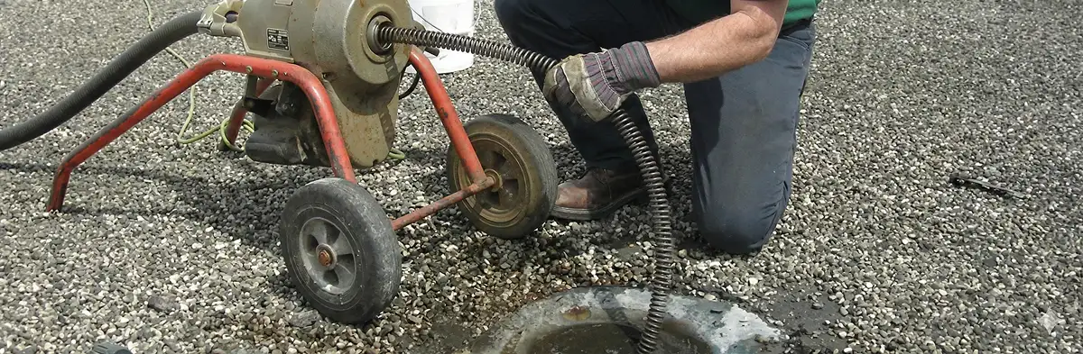 sewer rodding technician actively removing blockages from a sewer line in Bloomington, IN